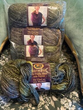 Lion Brand Shawl in a Ball 4 skeins Greens with gold thread woven through.